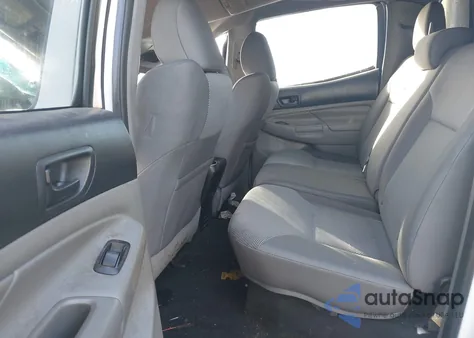 2015 Toyota Tacoma Base V6 z USA, uszkodzony, nr VIN 3TMMU4FN4FM077170